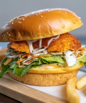 Mouth-watering chicken burger with fries, perfect for lunch in Sydney, Australia.